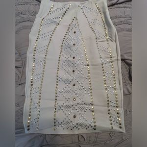 Body by Victoria color is a beige/cream studs are silver & gold